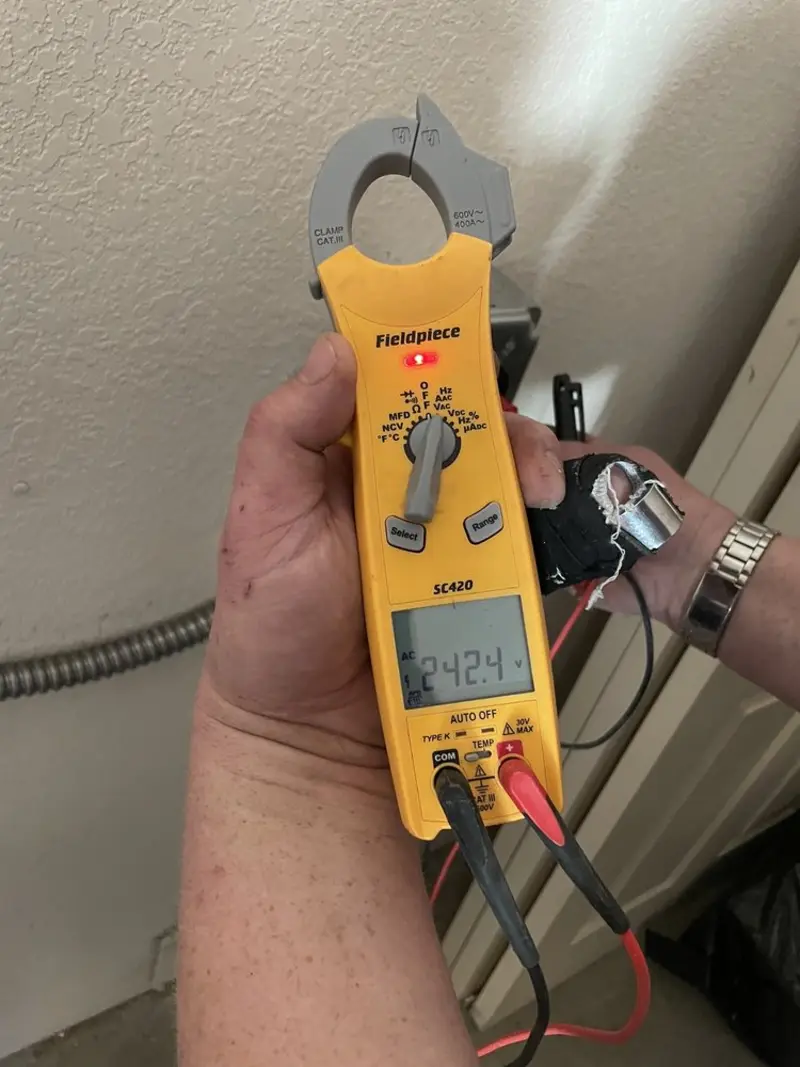 Voltage testing with clamp meter during Outlet Installation in Lake Elmo